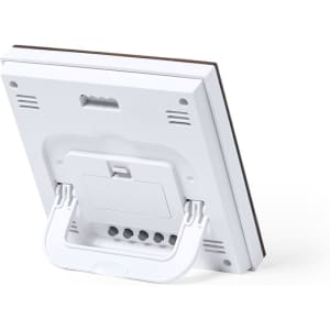 A white weather station with a foldable stand, featuring various sensors and ports on the back.
