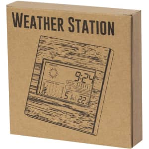 A weather station in a wooden design box, featuring a digital display with weather details and a logo.