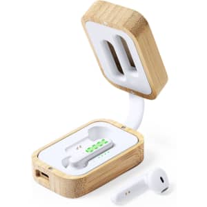 A pair of white earphones inside a bamboo charging case, with the case slightly open and an additional earphone beside it.