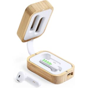 Wooden case with white earphones inside, featuring a green charging indicator and a logo on the exterior.