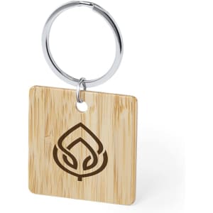 A natural bamboo keyring with a round metal loop and an engraved logo in a leaf design.