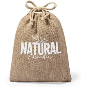 A natural jute drawstring bag in a light brown colour with a logo design in white.