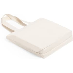 A cream tote bag with long straps, featuring a simple design and no visible logo.