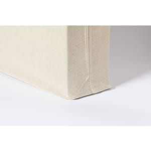 A beige tote bag with a structured base, featuring a simple design and a visible logo.