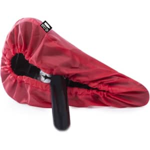 A red saddle cover with a fitted design, featuring a logo, suitable for protecting a bicycle seat.