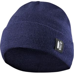 A navy blue beanie hat with a logo on the side. Made from a knitted material.