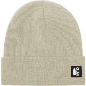 A beige beanie hat with a fold-up cuff and a logo on the side.