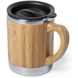 A travel mug with a bamboo exterior, stainless steel base, and a black lid. It features a wooden handle.