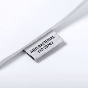 A white antibacterial lanyard with a small tag indicating antibacterial properties. It features a branding logo.