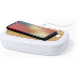 A white UV sterilizer box with a wooden lid, featuring a smartphone charging on top.