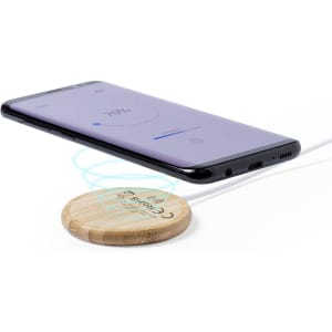 A wireless charger with a wooden base and a smartphone above it, displaying a battery percentage on the screen.