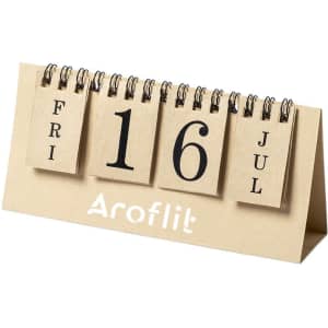 A desk calendar with a beige stand, featuring flip-style date cards in black and a logo at the bottom.