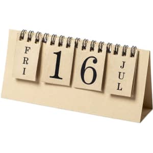 A desk calendar featuring a beige stand with black numbers and letters for the date and day. It includes a logo.