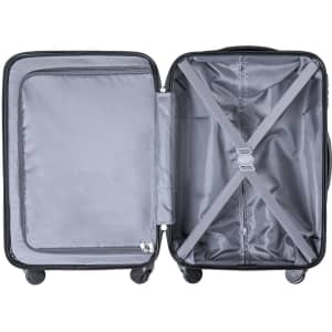 An open black wheeled trolley bag with a grey interior and cross straps for securing content.