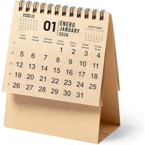 A desk calendar with a beige cover, featuring a spiral binding and a visible month and date layout.