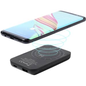 A power bank in black, featuring a wireless charging pad and a smartphone hovering above it.