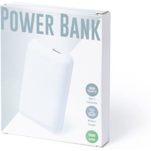 A white power bank in packaging, featuring a Type-C connection and a wireless charger. Includes specifications on capacity.
