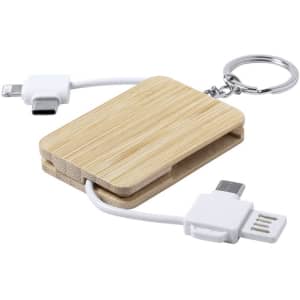 A bamboo charging cable keychain with white connectors, featuring a compact design and a keyring attachment.