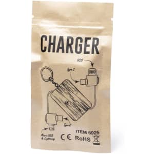 A charging cable packaged in a brown paper bag, featuring USB, Type C, and Lightning connectors. It has a keychain attachment.