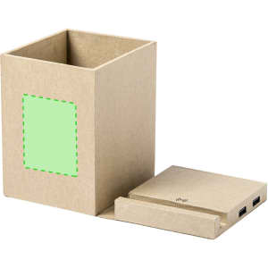 A brown cardboard pencil holder with a removable base that features a wireless charging pad and USB ports.