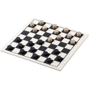 A Parchess game set featuring a black and white checkerboard with wooden pieces in light and dark shades.