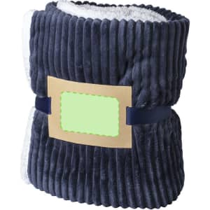 A navy blue Karovix blanket with a soft, fluffy lining, featuring a simple branding label.
