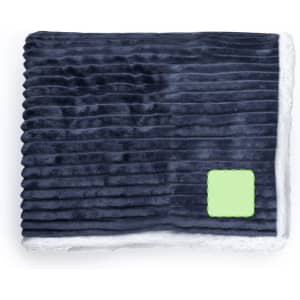A navy blue blanket with textured stripes and a soft white underside, featuring a logo on the corner.