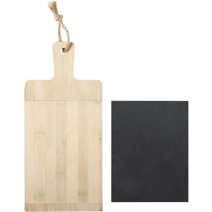 A bamboo cutting board with a natural finish and a black slate board, both featuring a hanging loop.