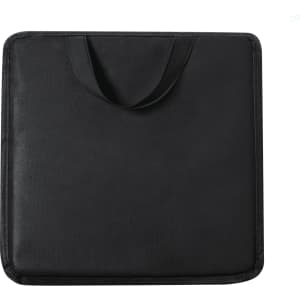 A black cushion with a handle, designed for comfort and portability. It features a simple, solid texture.