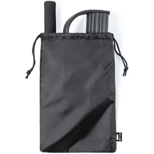 A black drawstring bag containing a grey exercise band and a handle. The bag has a logo.