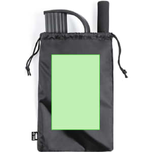 A black drawstring bag containing a rolled black exercise band and a black handle. The bag has a blank green area.