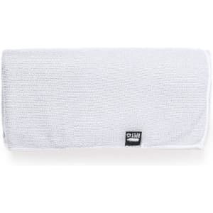 A white absorbent towel with a textured surface and a logo on one corner.