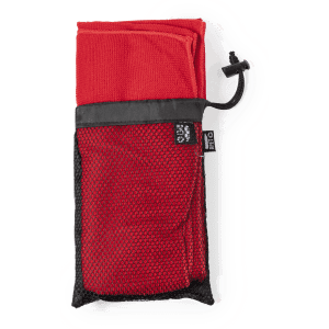 A red absorbent towel packaged in a black mesh storage bag, featuring a drawstring closure.