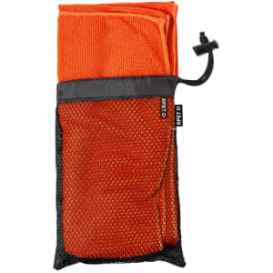 An orange absorbent towel folded inside a black mesh pouch, featuring a drawstring closure.