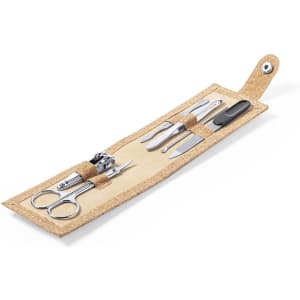 A beige manicure set featuring scissors, a nail clipper, tweezers, and a file, all neatly organised in a foldable case.