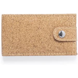 A tan burlap-style case with a snap closure, designed for holding a small manicure set. It features a logo.