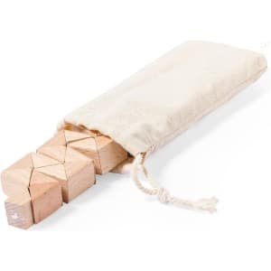 A set of wooden puzzle blocks in a natural cotton bag, featuring a light wooden colour and geometric shapes.
