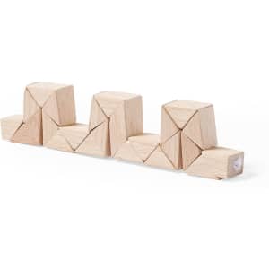 A set of wooden geometric blocks arranged in a line, featuring natural wood colour and various shapes.