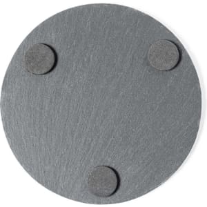 A round grey coaster with three rubber feet on the bottom, designed for stability and surface protection.