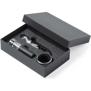A wine set in a black box featuring a corkscrew, pourer, and stopper, all nestled in soft padding.