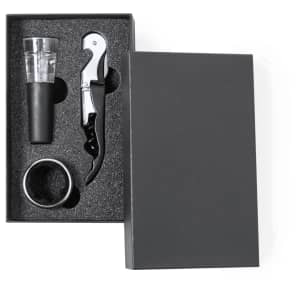 A wine set in a black box, featuring a corkscrew, pourer, and a wine ring. The items are arranged neatly within.