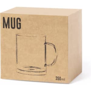A transparent glass beer mug in a plain, brown cardboard packaging. The mug has a handle and holds 350 ml.