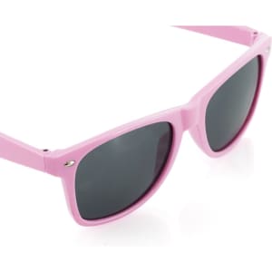 Pink sunglasses with dark lenses and a simple design, featuring a logo on the frame.