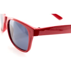 Red sunglasses with a glossy finish and dark lenses, featuring a logo on the side.