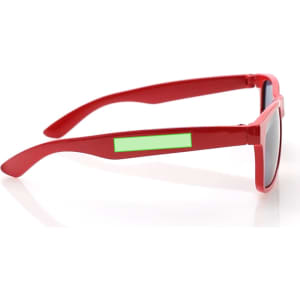 Red sunglasses with grey lenses and green accents on the arms, featuring a logo on one side.