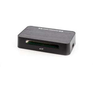 A compact black card reader with a CF slot, featuring a sleek design and a textured surface.