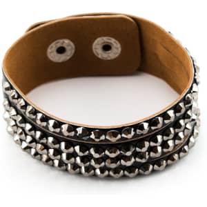 A black leather bracelet adorned with silver studs, featuring a simple snap closure.