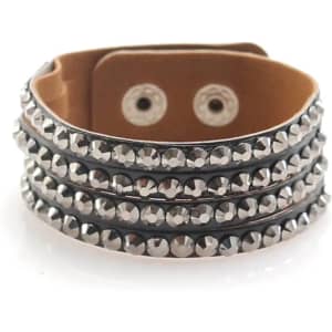 A black bracelet with silver studs wrapped in three rows, featuring a leather backing and snap closures.