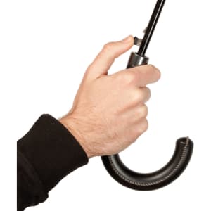 A hand holds a black umbrella with a curved handle and a metallic grip. The umbrella has a sleek design.