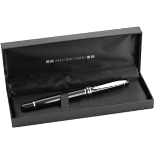 A black pen with silver accents inside a black box with a satin interior. The box has a logo on the inside.